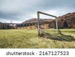 Small photo of Old soccer gate on the green grass playground near the famous Glenfinnan viaduct in Scotland, United Kingdom.