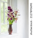 Iris Flowers In Glass Vase On...