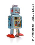 Small photo of Old cheap toy robot isolated on white background