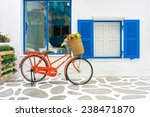 The decoration of vintage orange bicycle and white building