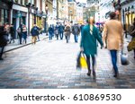 Shoppers holding hands in busy London high street