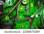 Small photo of gears and pulleys in agricultural machine