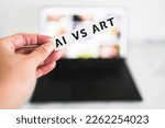 AI vs Art  text in front of laptop bokeh with out of focus images, concept of Artificial Intelligence creating generative content based on art made by human authors