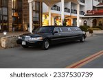 Small photo of Marina Dinevi, Sveti Vlas, Burgas, Bulgaria - 07.212023. Luxury black limousine awaiting in front of a hotel