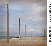 Cement Beach With Wooden Poles...