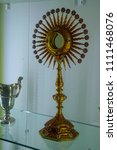 Small photo of MDINA, MALTA - APR 19, 2018 - Bejeweled chalice,pyx and monstrance in thee Treasury of St Paul's Cathedral, Mdina, Malta