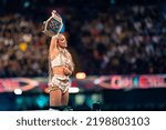 Small photo of Cardiff, Wales - September 3rd 2022: WWE Smackdown Women's Champion Liv Morgan posing with the title belt on the top rope at WWE Clash at the Castle