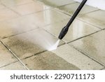Detail of cleaning terrace with ...