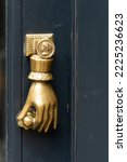 Golden Hand Holding A Door Knob ...