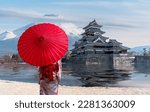 Small photo of japanese castle in tokyo with cherry blossom, traveller woman in Kimono traditional dress, Fuji mountain blue sky and reflec of castle in river , Tokyo city, Japan