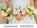 bridesmaid dresses in pastel are holding bouquets in a rustic style