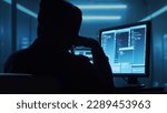 Small photo of Computer Hacker in Hoodie. Obscured Dark Face. Concept of Hacker Attack, Virus Infected Software, Dark Web and Cyber Security.