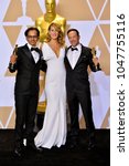 Small photo of LOS ANGELES, CA - March 4, 2018: Laura Dern, Bryon Fogel & Dan Cogan at the 90th Academy Awards Awards at the Dolby Theartre, Hollywood