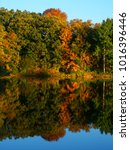 Beautiful fall colors reflect off a pond at Kettle Moraine State Forest in Wisconsin