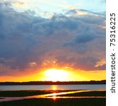 Small photo of Sunset over Lake Arbuckle of the Lake Wales Ridge State Forest in central Florida