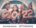 Men and women celebrating the new year 2022