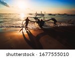 Silhouette Of Fishermen With...