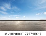 empty marble floor and snow mountains in blue cloud sky