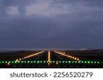 Small photo of Landing lights of the island airport in the evening
