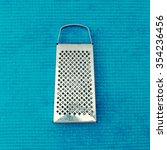 Metal Grater. Isolated On Blue...