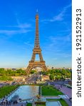 Small photo of View of Eiffel Tower from Jardins du Trocadero in Paris, France. Eiffel Tower is one of the most iconic landmarks of Paris. Sunset cityscape of Paris