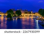 Small photo of Pont Neuf is the oldest bridge across the river Seine and island Cite in Paris, France. It is one of the symbols of Paris. Night cityscape of Paris