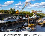 Small photo of Budapest Hungary Oct. 24, 2020: Old shipyard and boats. Dismounting dock. Vintage river cruisers and pleasure craft are maintained and dismounted here.
