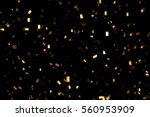 falling gold glitter foil confetti,  on black background, holiday and festive fun concept