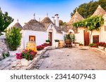 Famous Trulli Houses during a Sunny Day with Bright Blue Sky in Alberobello, Puglia, Italy