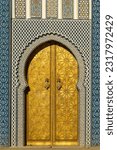 Small photo of Fez. Morocco. 11.28.2022. The royal palace founded by the Merinids in 1320. It opens onto the Place des Alaouites through huge doors chiseled in copper made by a local cr