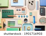 Flat lay of set of assorted modern stationery arranged in order on desk in office