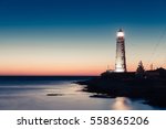 Lighthouse At Sunset In The...