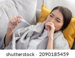 young sick asian woman lie... | Shutterstock . vector #2090185459