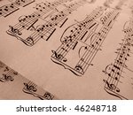 Small photo of sepia toned old musical notes background Mozart sonatina fragment