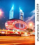 Small photo of Dubai, United Arab Emirates – February 9, 2021: The Museum of the Future with Arabic poetry on the facade at Sheikh Zayed Road (the main and longest street in Dubai) at night.