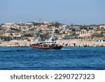 Small photo of Lampedusa,Province of Agrigento, Sicily,Italy,25 March 2023, African people migrants are rescued by Italian authority, Guardia di Finanza and Guardia costiera in the harbor of Lampedusa on 2023.
