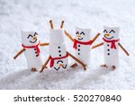 Happy funny marshmallow snowmans are having fun in snow
