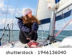 Young Woman Sit On Sailboat Bow ...