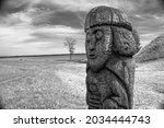 old wooden statue by the lake | Shutterstock . vector #2034444743