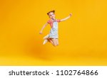 Funny child girl jumping on a...