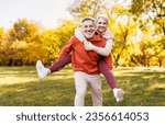 Small photo of Portrait of lovely happy elderly couple on morning run outside in city park, retirees wife and husband rejoice in active lifestyle, smiling woman tenderly embracing her spouse after routine jogging