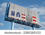 Small photo of Military dog tags with honor text in an American flag design on rustic gray wood wood on a billboard