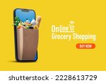 Online grocery shopping and home delivery: bag full of groceries coming out of a smartphone screen