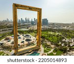 Small photo of Dubai UAE - December 2nd 2018 Aerial travel and tourism the Dubai Frame with city Skyline Zabeel Park Arabic Architecture desert suburbs business wealth Persian Gulf UAE