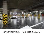 Small photo of View of a large underground parking lot, focus anyhow