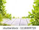 wooden table top with spring... | Shutterstock . vector #1118309720