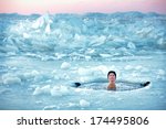 Winter Swimming. Man In An Ice...