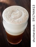 Small photo of Smooth Unctuous Creamy Home Brew Double IPA Beer Froth Details on a Wood Table
