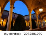 Forli, Emilia-Romagna, Italy: historic buildings at evening in the Aurelio Saffi square, church of San Mercuriale, the external cloister