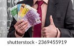 Small photo of business man in suit counting euro money, cash money concept